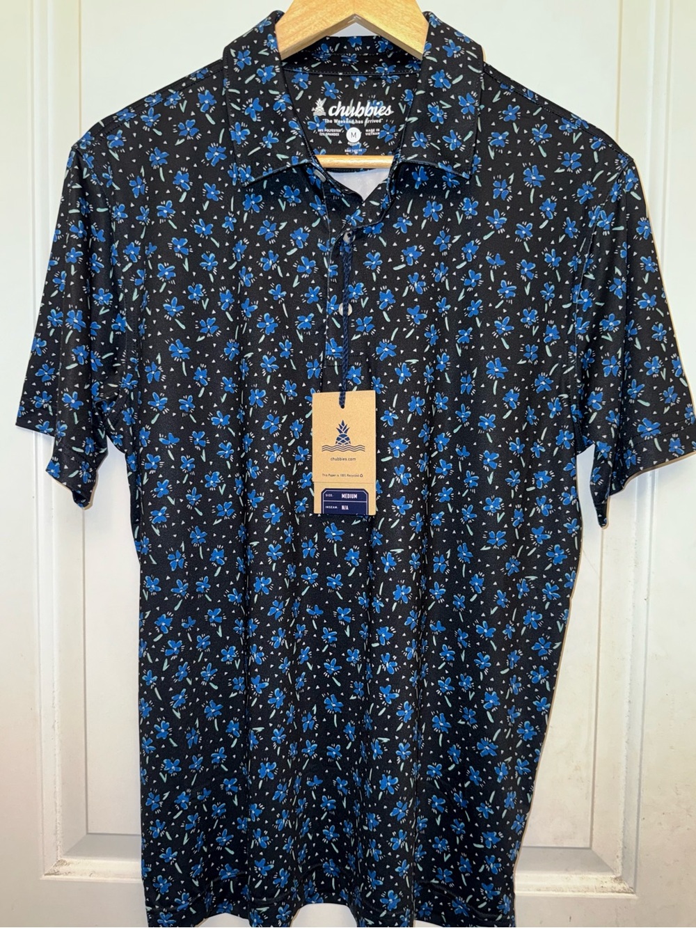 Chubbies “The Texas Blues” Performance Polo 2.0 in Black and Blue Floral Print